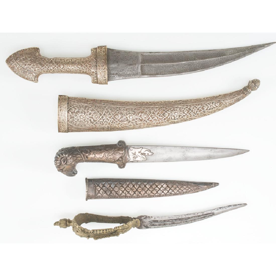 Lot of Antique Edged Weapons: Lot consists of three edged weapons including a 19th century Indian Bichwa as well as a silver-mounted dagger with 7" blade and ram's head pommel. Also includes Ottoman-style Khanjar, its blade adorne