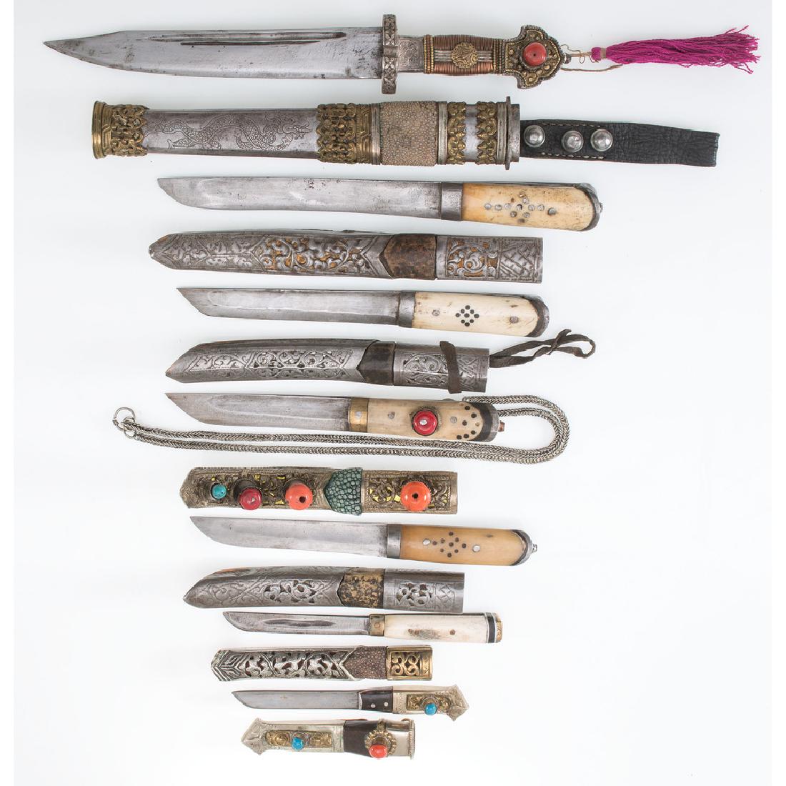 Lot of Seven Sino-Tibetan Weapons: Lot consists of seven Sino-Tibetan knives ranging in overall length between 6.25" and 13". Handle materials include bone, copper, brass, and stones; scabbards mounted with like materials.