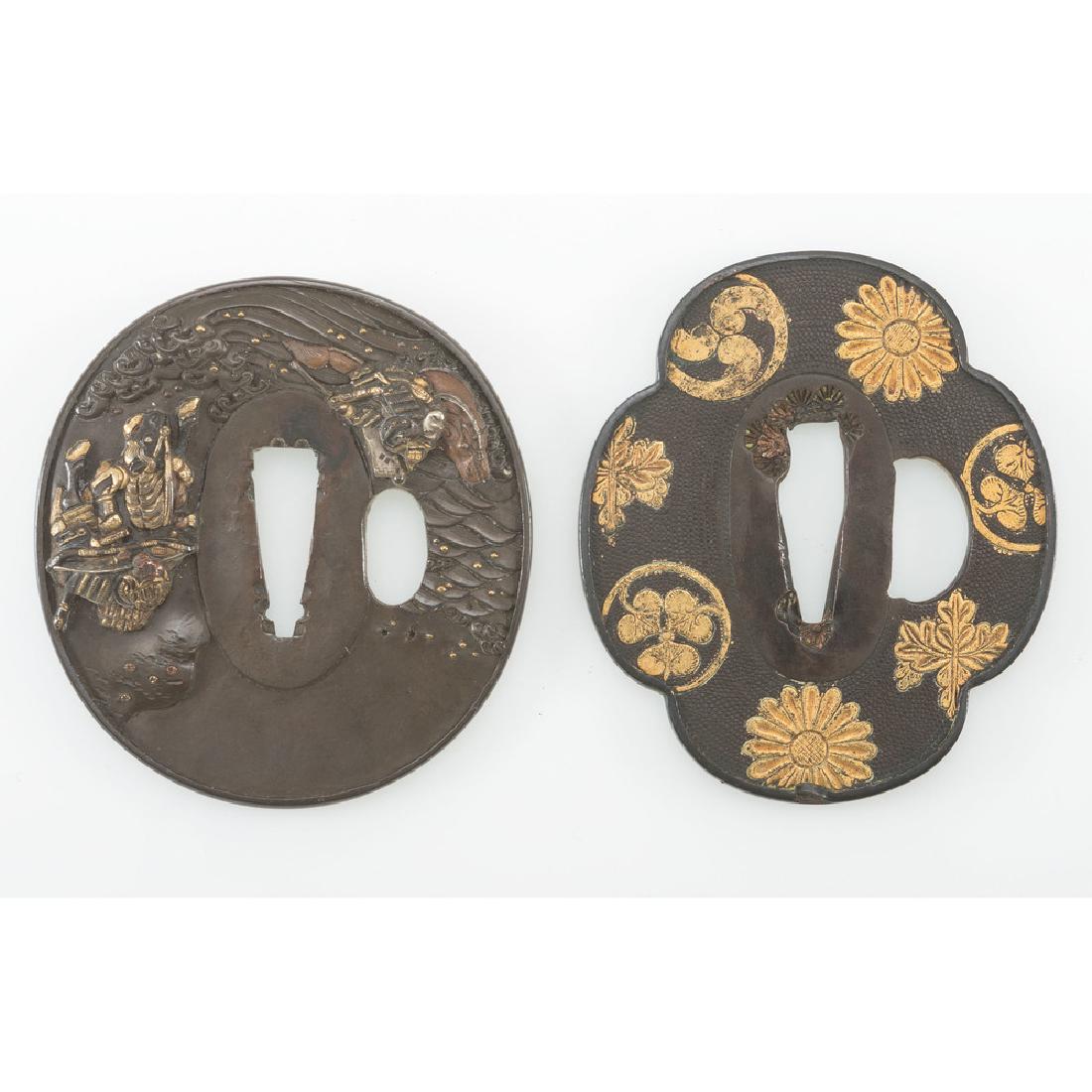 Pair of Fine Japanese Wakizashi Tsuba: Lot consists of two Tsuba for Wakizashi measuring 2.5" and 2.62" in diameter. One features the mon of the Tokugawa and Toyotomi clans with additional Tomoe and possibly Imperial chrysanthemum motifs.