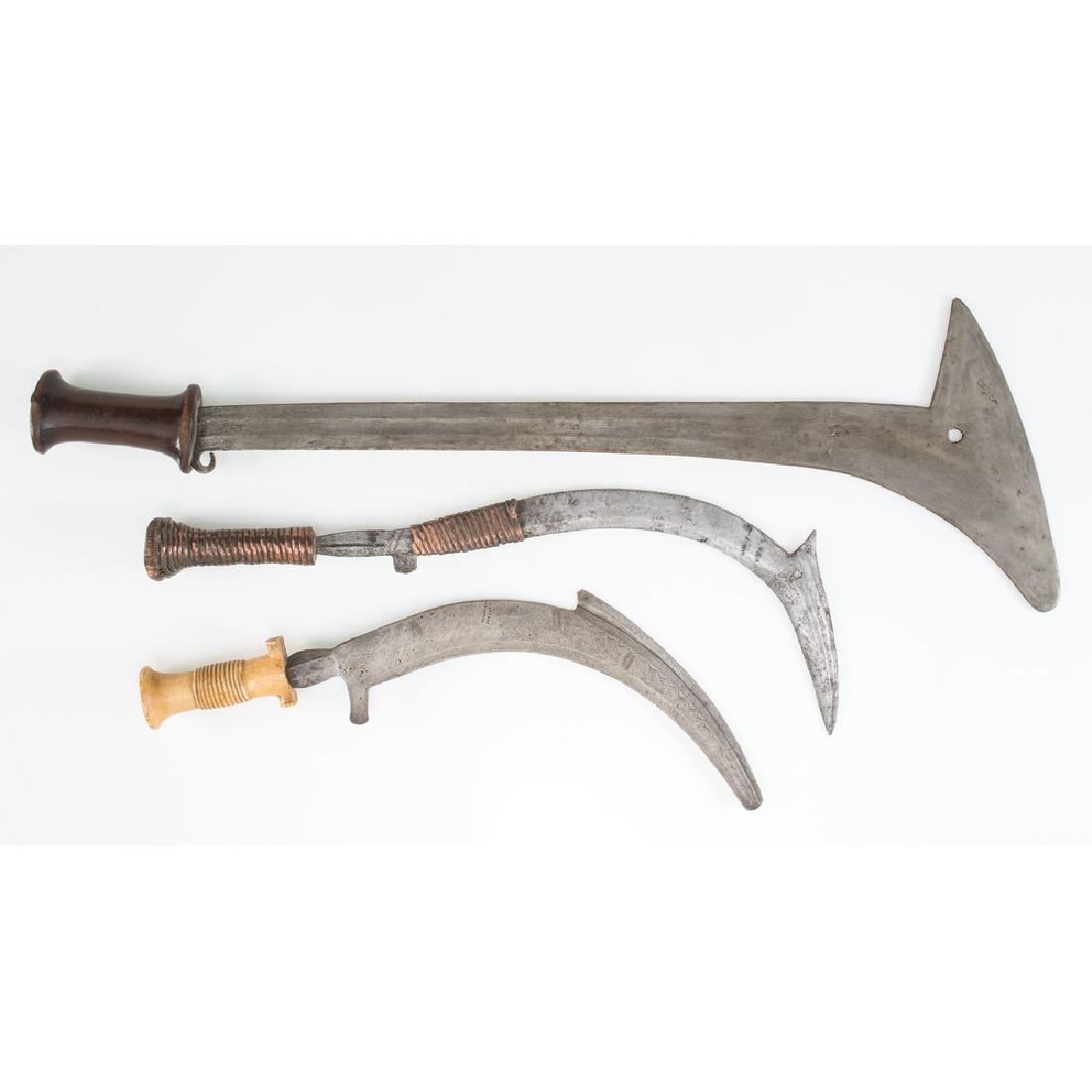 Democratic Republic of the Congo Gbaya Swords: Lot consists of three Gbaya swords, the largest measuring 24.5". Ca 1900. Mounting materials include wood, copper, and bone.