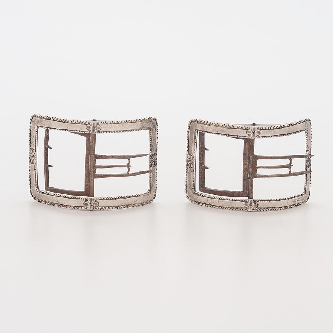 Early American Coin Silver Shoe Buckles, Daniel Dupuy: American (Philadelphia), 18th century. A pair of coin silver shoe buckles, one marked DD for Daniel Dupuy (1719-1807), each with engraved decoration and monogram ND; lg. 3, wd. 2 in. (each), total wt.