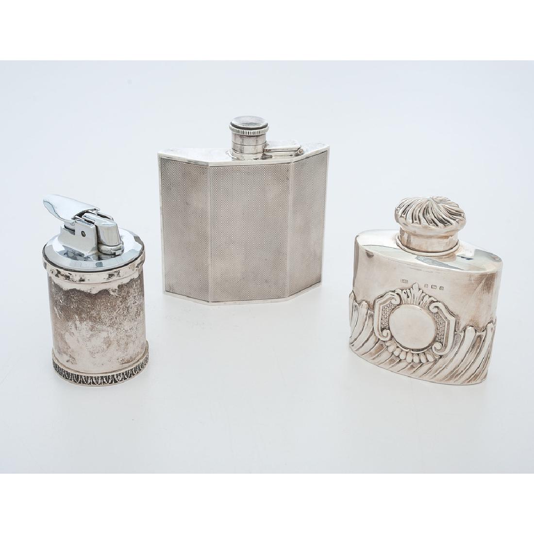 Birmingham Sterling Flasks, Plus: English (Birmingham), first quarter 20th century. A Levi & Salaman sterling silver repoussé flask, dated 1904, marked on lid and body, and a 1924 Art Deco sterling hip flask, full hallmarks with ille