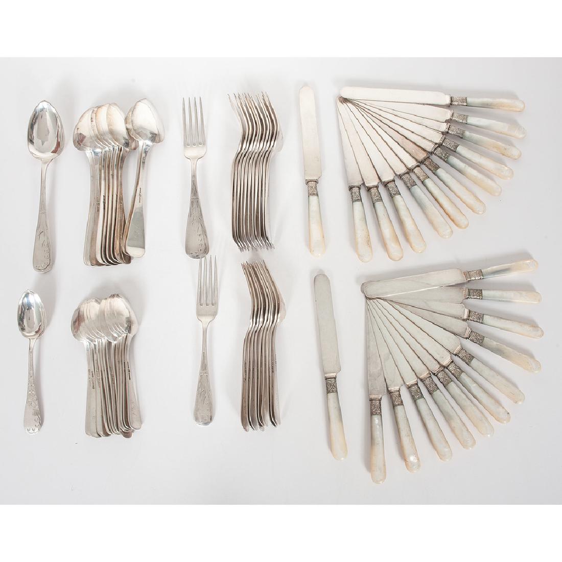 Duhme & Co. Sterling Flatware Set: American (Cincinnati), 19th century. A set of sterling silver flatware by Duhme & Co., seventy-one pieces in total, with engraved bellflower decoration, including thirteen teaspoons, one in the Lily p