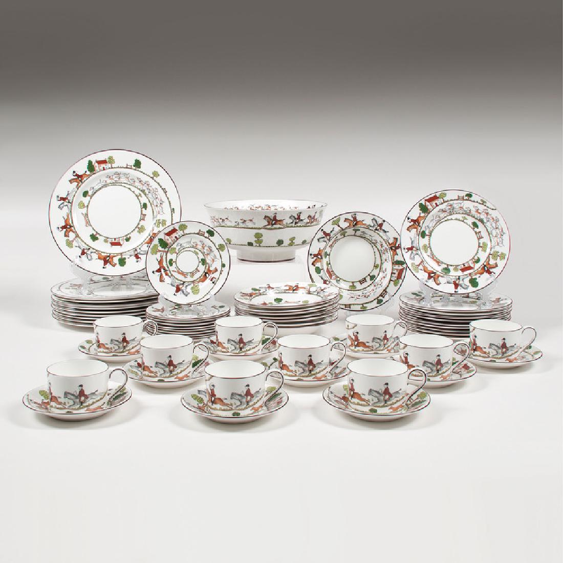 Coalport Porcelain Dinner Service, Hunting Scene: English, 20th century. A fifty-nine piece porcelain dinner service by Coalport in the Hunting Scene pattern, including ten dinner plates, eight soup bowls, ten cups, ten saucers, ten dessert plat