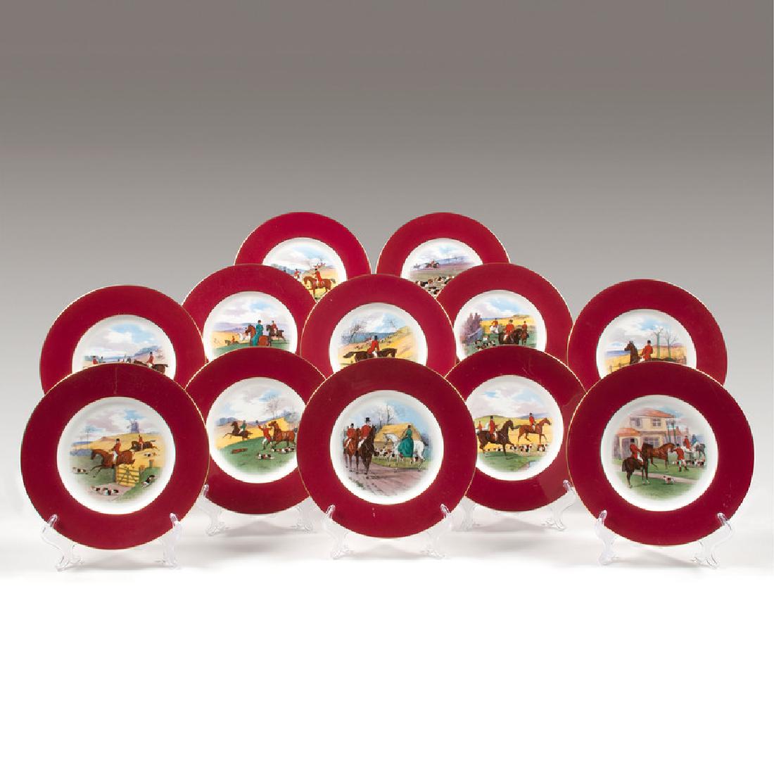 Minton Porcelain Fox Hunt Plates: English, late 19th-early 20th century. Twelve porcelain plates by Minton with various painted fox hunt scenes in center surrounded by maroon border, each marked for maker and J.E. Caldwell & Co. Phila