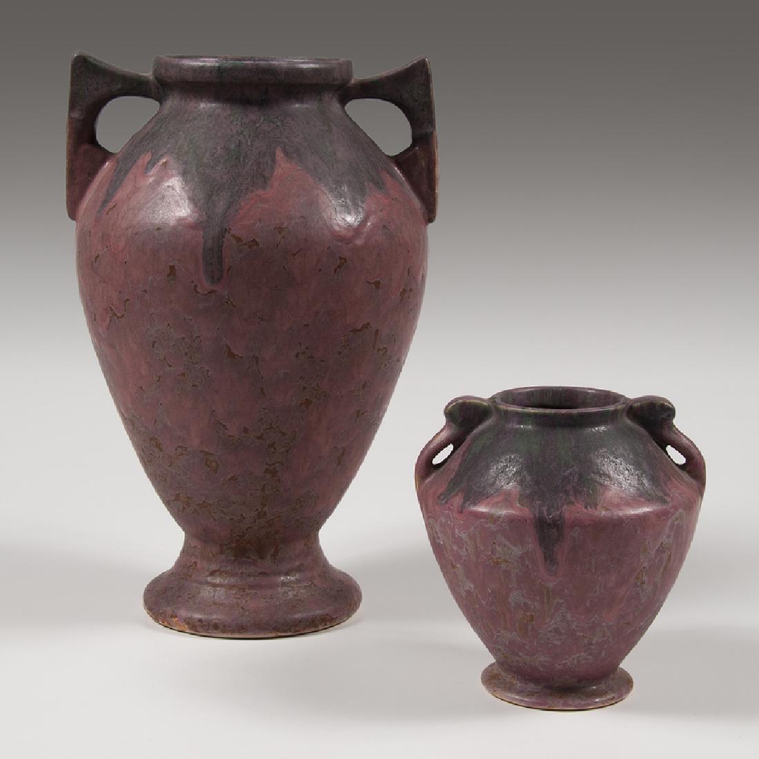 Roseville Pottery Carnelian II Vases: American, ca. 1926. Two Roseville Pottery vases in the Carnelian II pattern, including one in tall urn-form with handles and one in short urn-form, each unmarked; larger ht. 15, wd. 10, dp. 10.5 in.&n