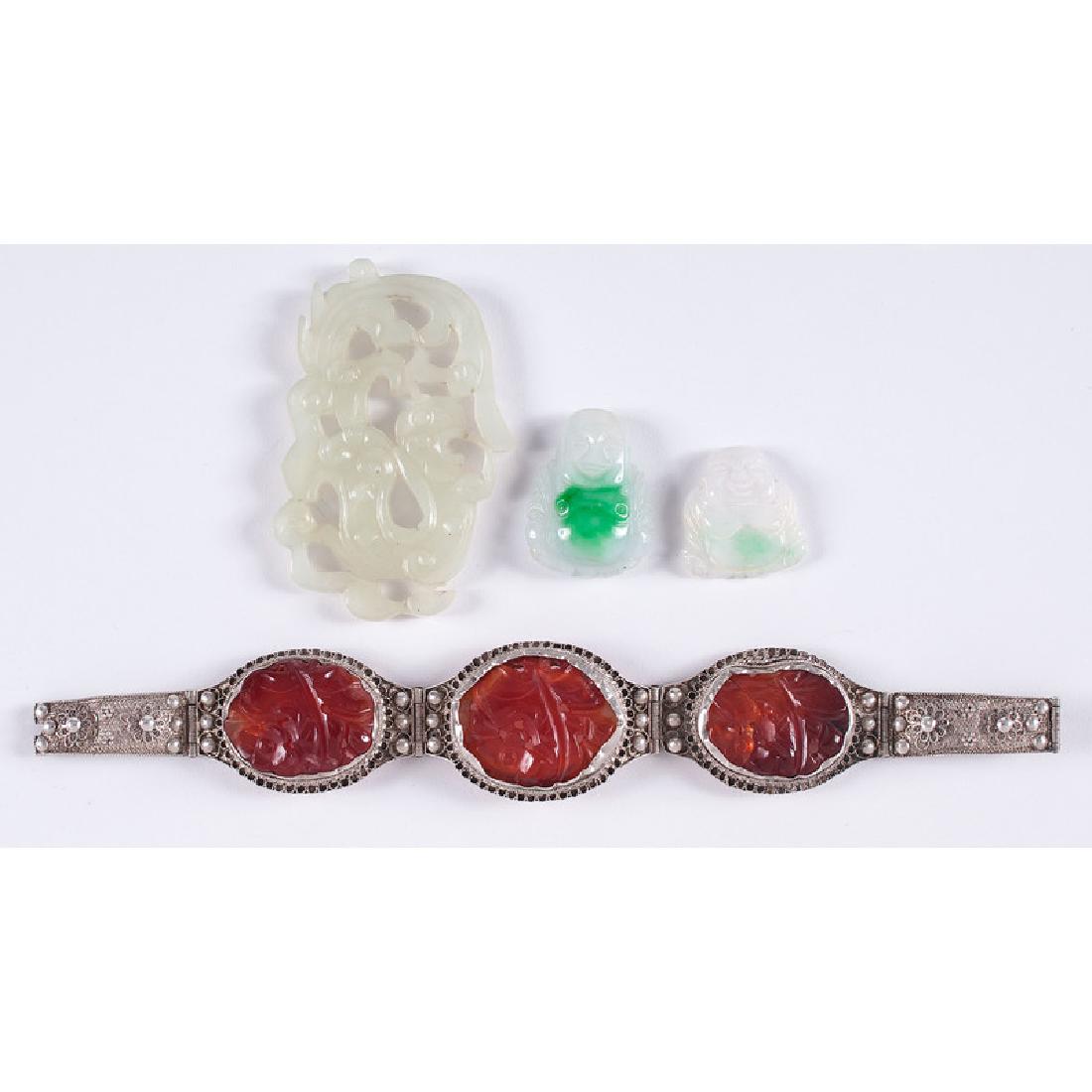 Jade Pendants and Silver Bracelet with Carnelian: Chinese, 20th century. Three jade pendants, including two Buddhas, and a silver filigree bracelet with carved carnelian pendants, silver marked on underside; bracelet lg. 7.5 in., largest jade lg. 2.5