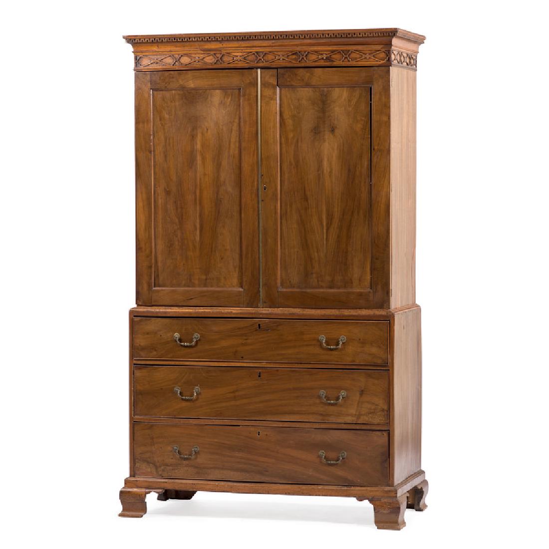 George III Chippendale Linen Press: English, 18th century. A George III Chippendale linen press in mahogany with oak secondary and a pine back, upper case cornice having wall of troy dentil molding over a Chinese Chippendale frieze, two