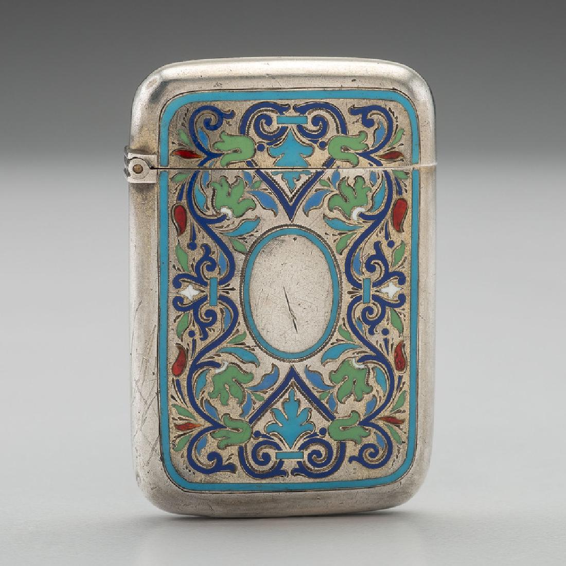 Enameled Russian Silver Match Safe: Russian, likely 20th century. A silver match safe decorated with blue, green, white, and red enamel floral patterns, stamped with kokoshnik mark on interior rim; ht. 2, wd. 1.25, dp. 0.5 in. Provenanc