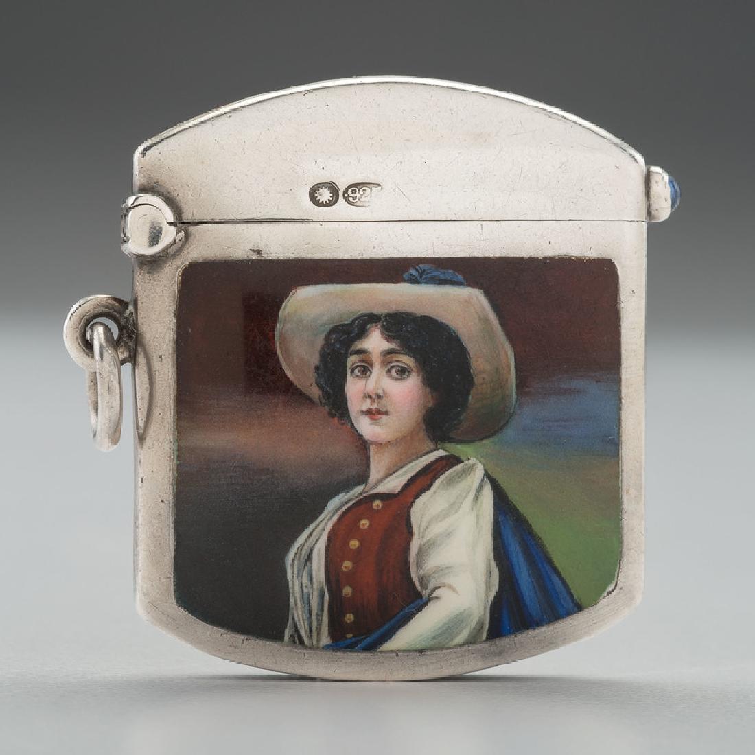 Sterling Match Safe with English Import Marks: Ca 1904-1906. A sterling silver match safe with a sapphire lift and enamel panel depicting a young woman in a hat and cloak, engraved on verso Smythie. 1910. Marked on interior rim and lid with London