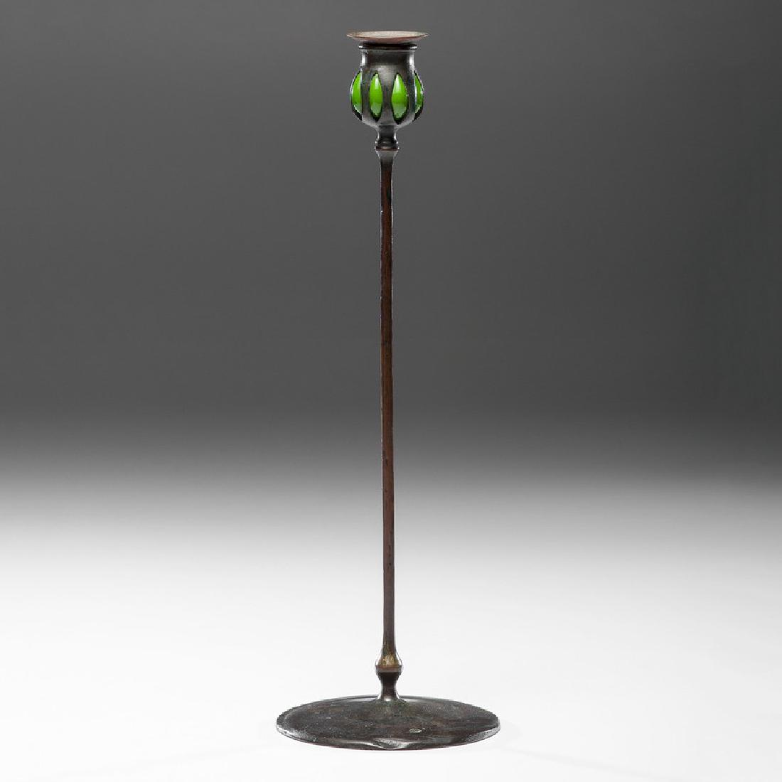 Tiffany Studios Bronze and Favrile Glass Candlestick: American (New York), ca 1900-1902. A Tiffany Studios bronze candlestick with blown out favrile glass decoration, #21100, with impressed marks to underside; ht. 17.5 in.