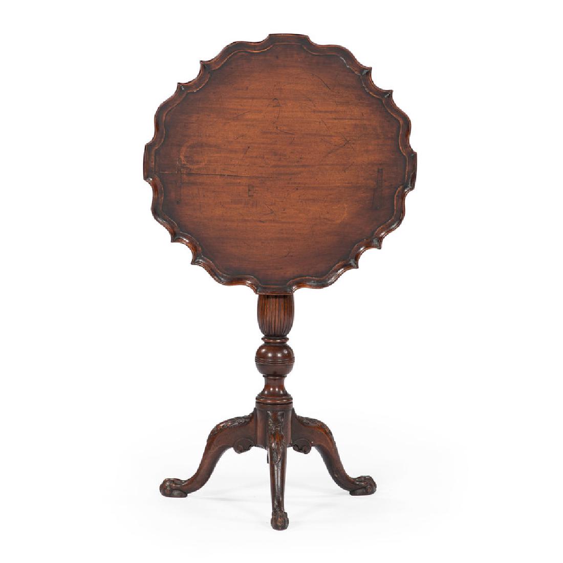 American Chippendale Pie Crust Tilt Top Tea Table: American (probably Pennsylvania), late 18th century. A Chippendale tilt top table in mahogany, having a pie crust tilt top surface, over a turned and carved standard, all rising on tripod cabriole leg