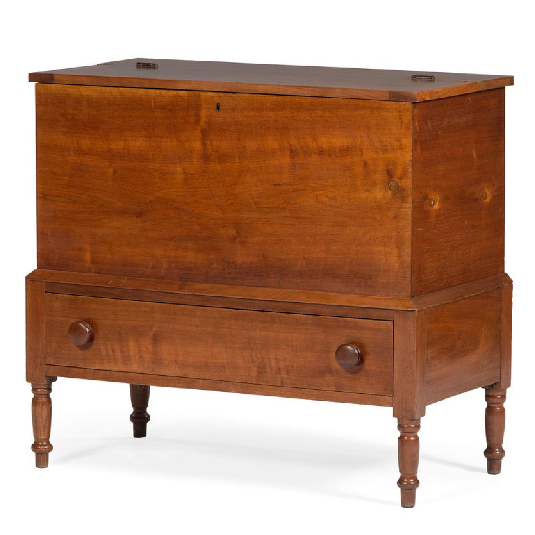 Sugar Chest in Walnut: American, 19th century. A sugar chest in walnut and poplar secondary, having a hinged lift top surface with interior divider, the dovetailed case above a single full dovetailed drawer with wooden mush