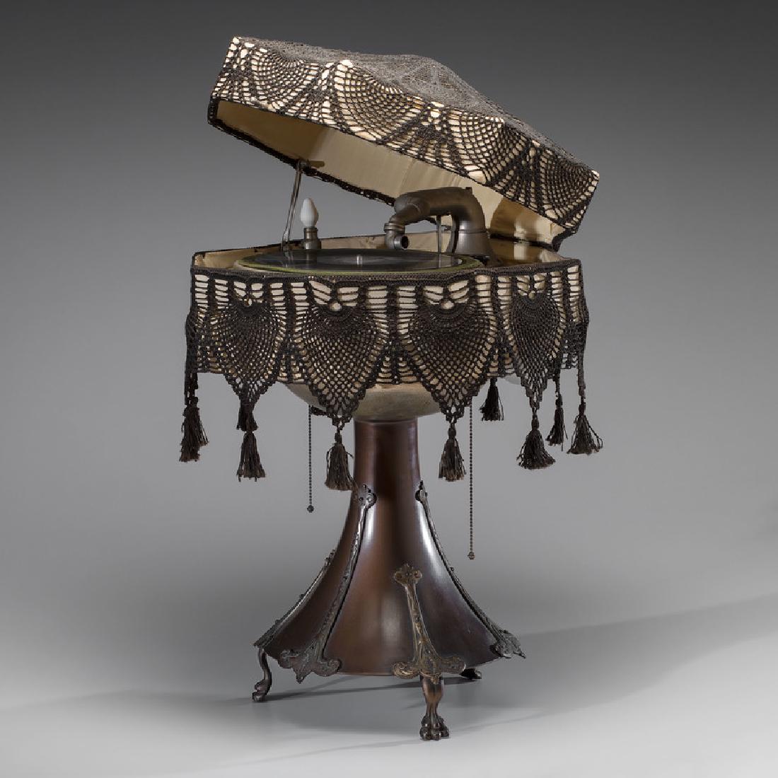 Burns-Pollock Electric Phonograph Lamp: American, 20th century. A Burns-Pollock Electric phonograph lamp with octagonal cloth shade decorated with black crochet pattern and hanging tassels, manufacturer's label reads BURNS-POLLOCK ELEC. MFG