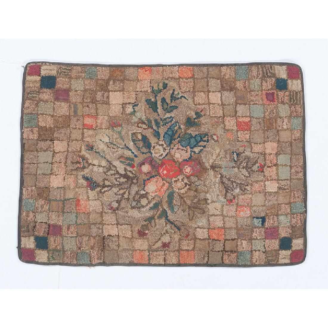 Floral Hooked Rug on a Checkered Ground: American, 19th century. A hooked rug with checkered pattern, with a central fruit and floral motif; 44.375 x 31.375 in. Provenance: Sold by the Art Institute of Chicago