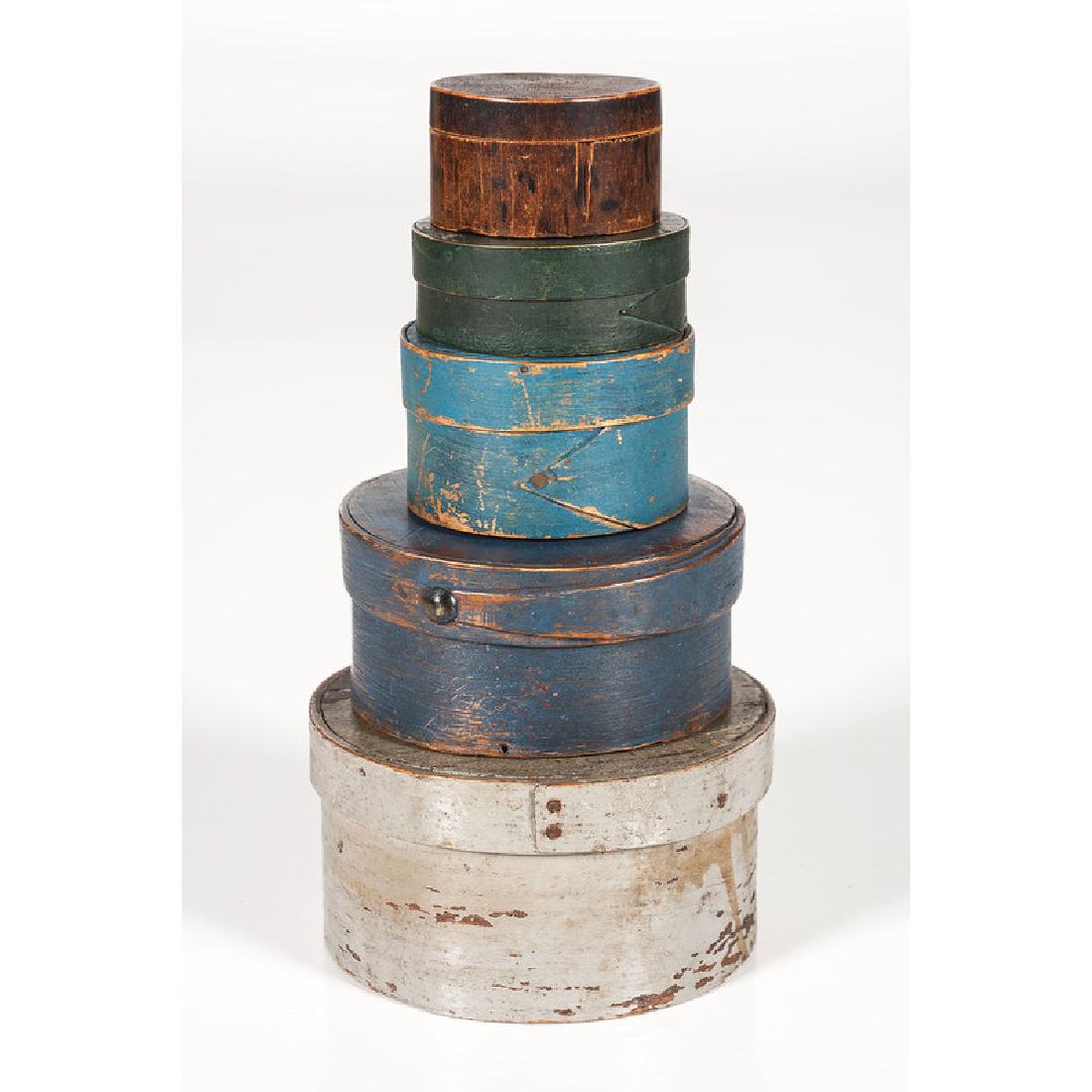 Graduated Bentwood Pantry Boxes: American, 19th century. A group of five round bentwood pantry boxes of graduated size, four lap-seamed construction and one carved, three painted blue and one painted green. One dated 1866 to undersid