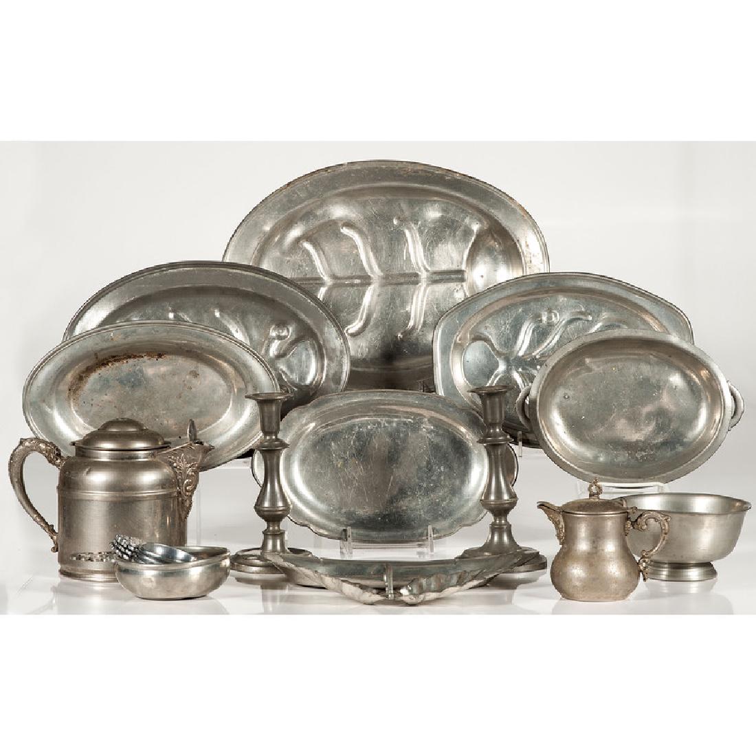 Pewter Trays, Porringers and Other Tablewares: 19th-20th century. Eighteen pieces of pewter, including eight trays, a pair of candlesticks, five porringers, a teapot, a creamer and a footed bowl. Makers include International Pewter, Colonial Pewte