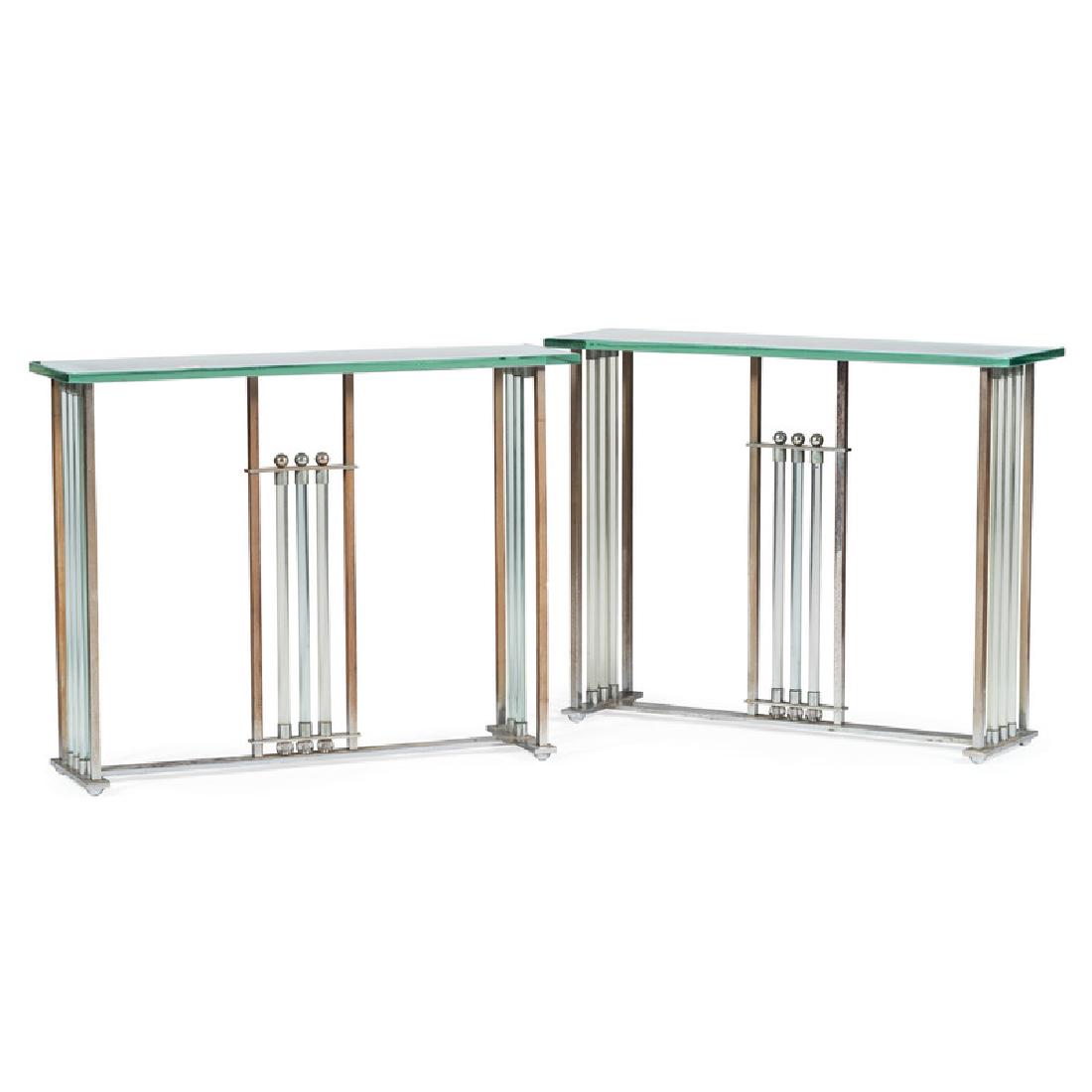Contemporary Chrome and Glass Console Tables: Continental (possibly French), 20th century. A pair of console tables in chrome and steel, each having a removable glass top, over trestle form base, vertical glass tubes and chrome accents; ht. 33, w