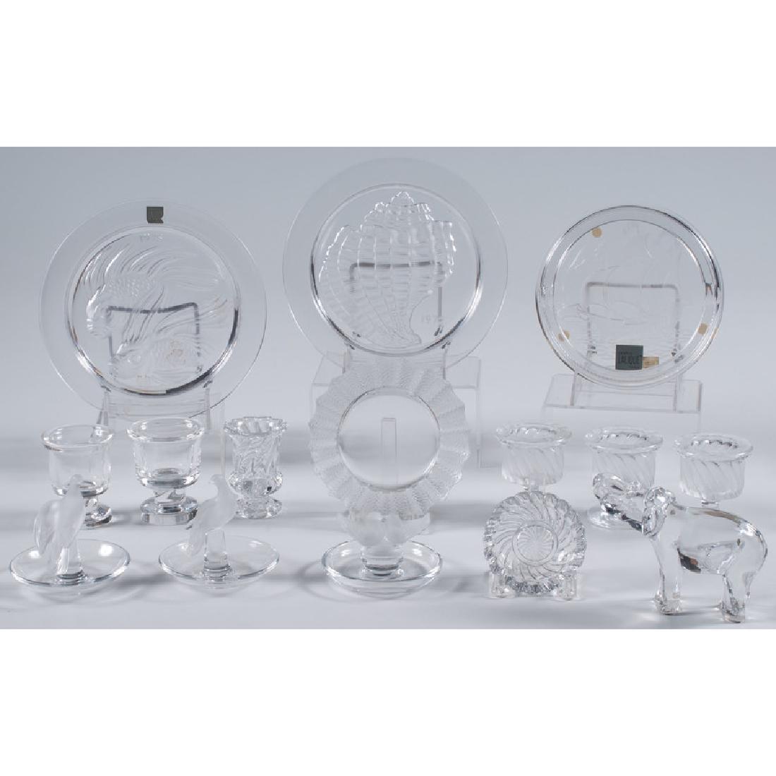 Lalique, Baccarat & Steuben Glass: 20th century. A group of crystal glass pieces including three plates, four ring trays and three footed beakers by Lalique, two footed beakers by Steuben and an elephant, dish and footed beaker by Bacc