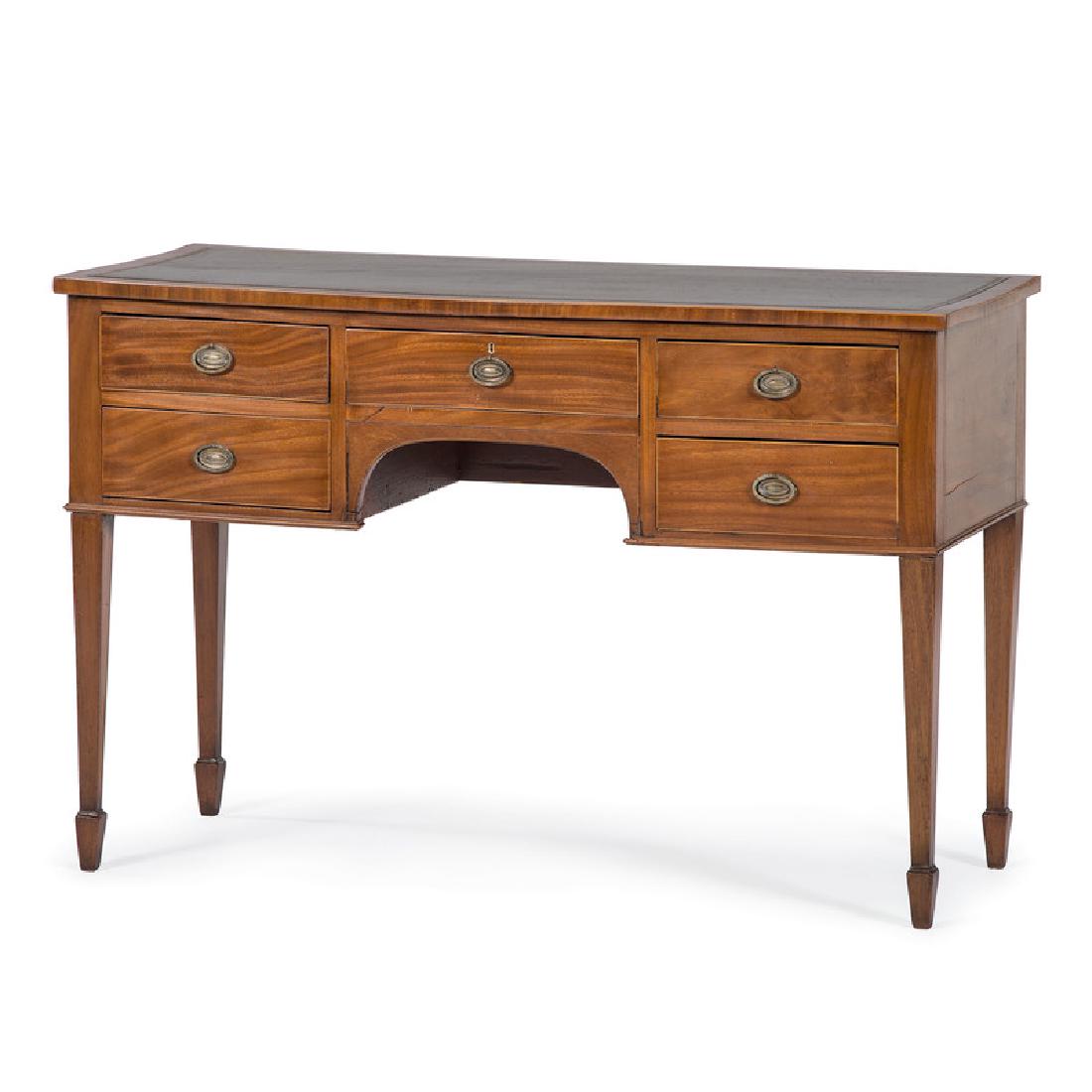 English Hepplewhite Writing Desk: English, 19th century. A Hepplewhite writing desk in mahogany, having a rectangular surface with perimeter line inlay and inset writing surface, over five aligned dovetailed drawers with brass pulls, 