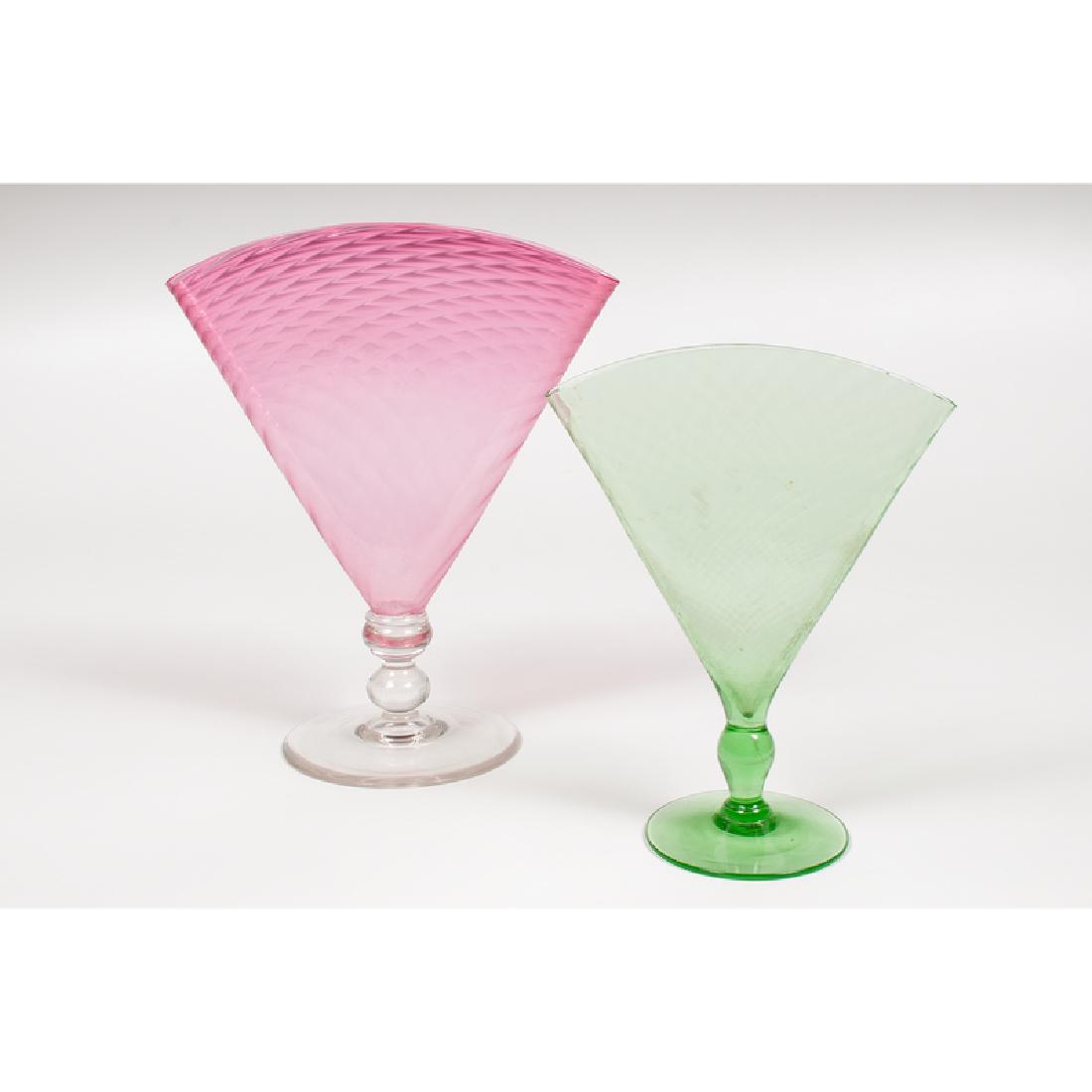 Steuben Fan Vases: American, ca. 1920s. Two glass vases by Steuben in fan form, number 6287, including one in pomona green and one in gold ruby with colorless foot and stem, each unmarked; larger ht. 10.75, wd. 9, dp. 5