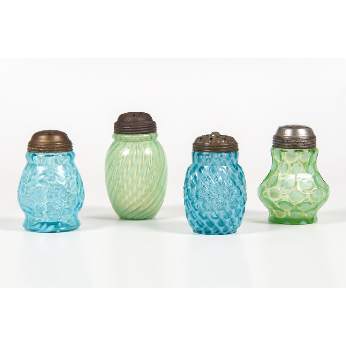 Art Glass Sugar Shakers: American, late 19th-early 20th century. Four art glass opalescent sugar shakers, including one blue windows swirl shaker (No. 326) by Hobbs , one blue daisy and fern shaker, one green coinspot nine-pa