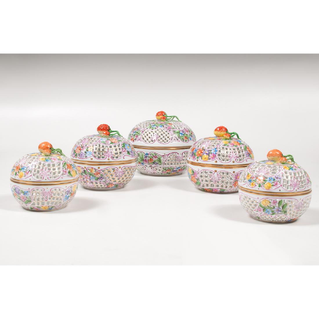 Herend Covered Bonbon Dishes: Hungary, late 20th century. Five pierced bonbon dishes of graduated size, all with strawberry finials and floral decoration, all marked for maker on underside, including one marked 6211/C , two marked