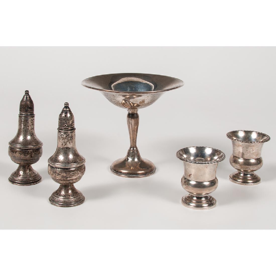 American Sterling Hollowware: American, 20th century. Five pieces of weighted sterling hollowware, including one small compote by Presner , one pair of shakers by the D.S. Spaulding Co. , and two toothpick holders by the Webster C