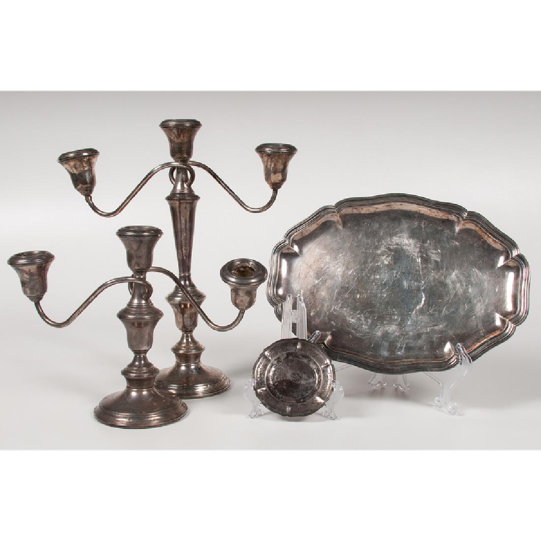 Sterling Dishes and Candelabras: German and Mexican, early-mid-20th century. Four pieces of sterling silver, including one German dish marked for Gebruder Friedlander , one taller and one shorter International Silver Co. weighted can