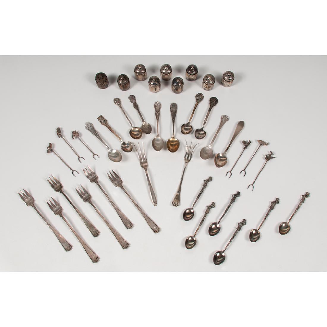 Sterling Tablewares, Plus: 20th century. Thirty-three sterling tablewares by various makers, including nineteen American pieces, including six Gorham demitasse forks, nine individual salt shakers, two lemon forks, and two demit