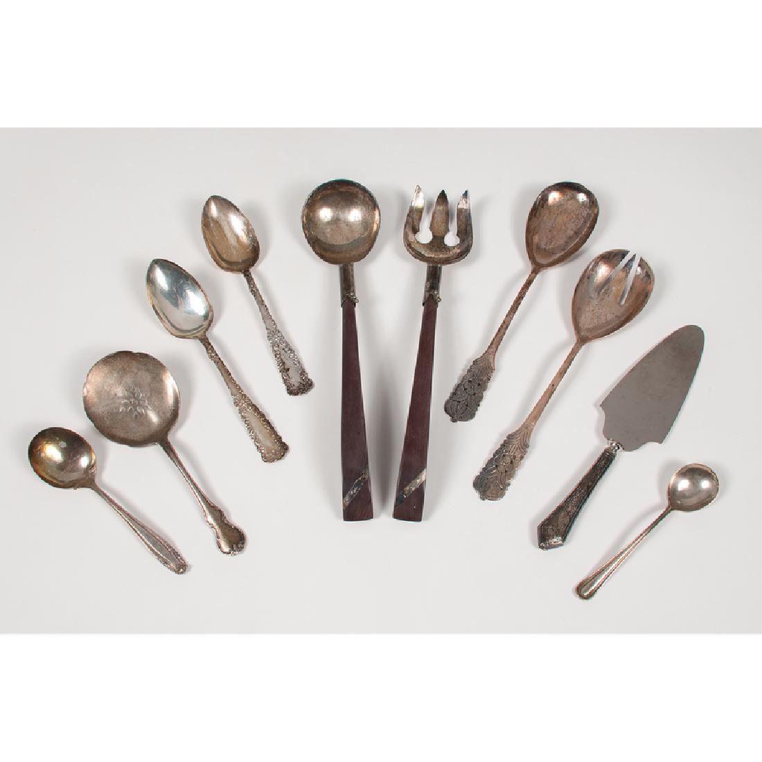 Sterling Serving Utensils: 20th century. Ten pieces of sterling flatware by various makers, including a pair of salad servers marked PERU , two matching serving spoons (American), one Towle pierced tomato server (American), on