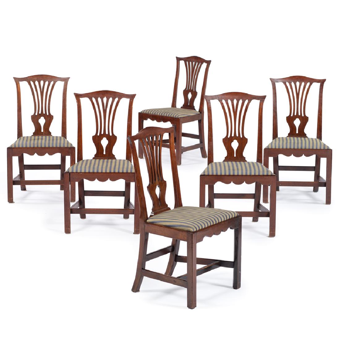 George III Chippendale Dining Chairs: English, early 19th century. A set of six George III Chippendale dining chairs in mahogany, each having a shaped crest over pierced splat, upholstered slipper seat above scalloped front seat rail, ris