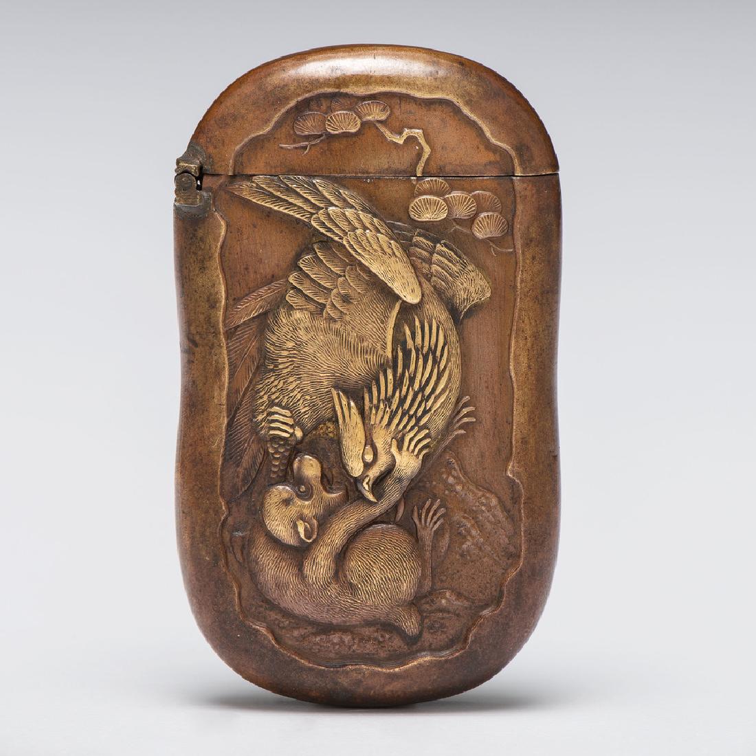 Japanese Brass and Bronze Match Safe: Japanese, late 19th-early 20th century. A brass and bronze match safe with a bird and monkey motif on both sides; ht. 2.5, wd. 1.5 in. Provenance: Property from the Match Safe Collection of David and 