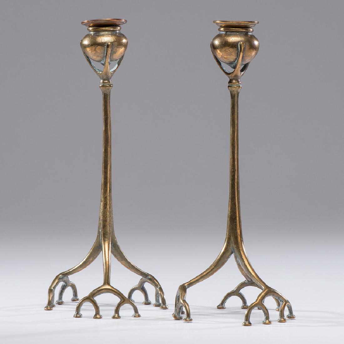 Tiffany Studios Bronze Root Candlesticks: American, 20th century. A pair of bronze candlesticks with pot forms rising from a stem of tripod root-form feet, each marked on underside ; Tiffany Studios / New York / 1200 ; each dia. at base 5.5, 