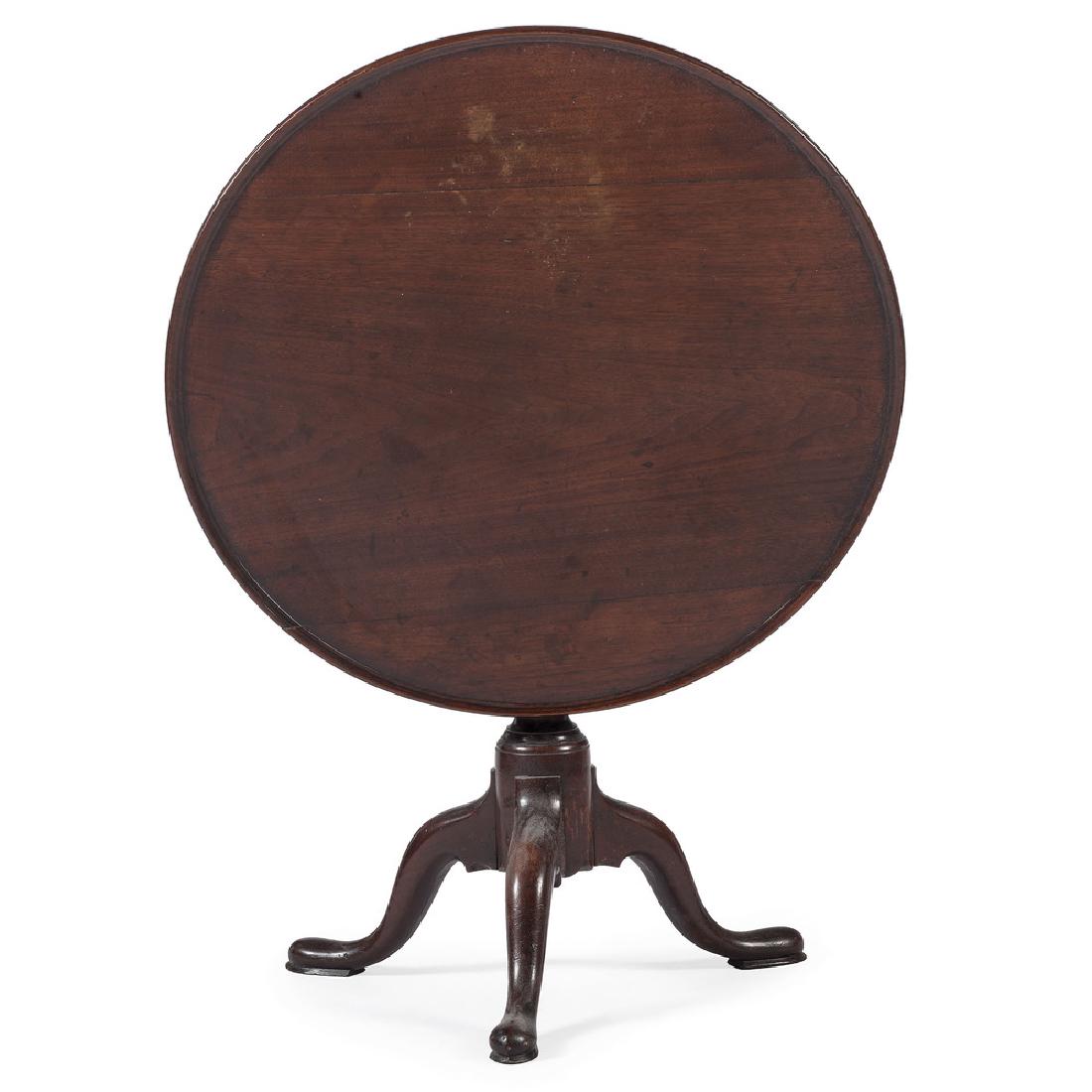 American Queen Anne Mahogany Breakfast Table: American (Rhode Island), mid-18th century. A tilt top breakfast or tea table in mahogany, having a three-board dish top, over an urn-turned pedestal and tripod base, on cabriole legs and slipper feet.