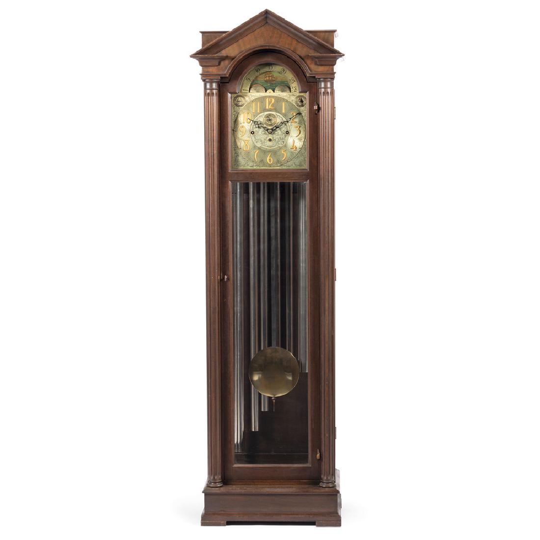 Herschede Seven-Tube Tall Case Clock: American, 20th century. A Herschede seven-tube tall case clock, having an engraved brass dial, the architectural case with columns and block feet, with later label 1265 to back of case. The rear of th