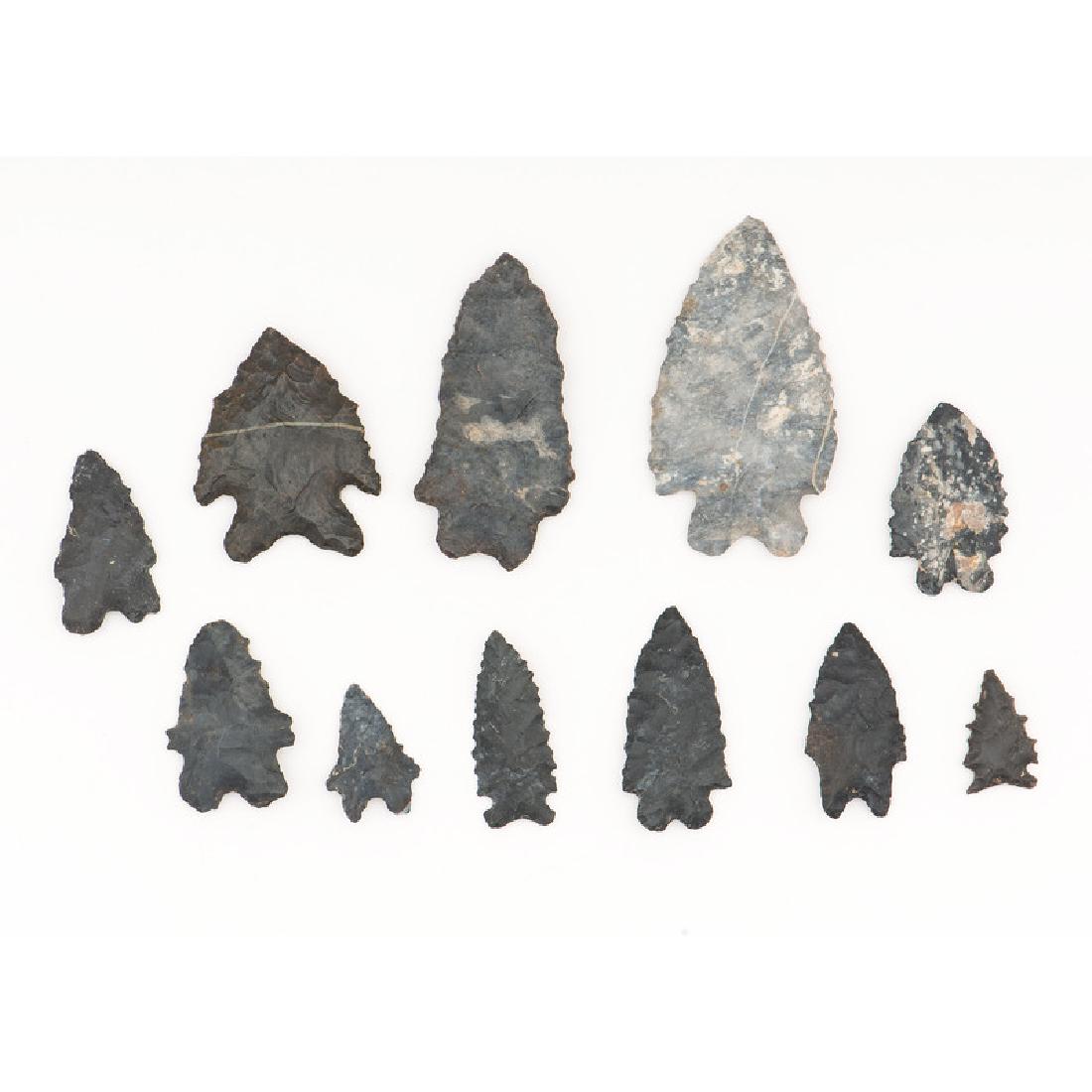 A Collection of Coshocton Flint Bifurcated Points,: A Collection of Coshocton Flint Bifurcated Points, From the Collection of Jon Anspaugh, Wapakoneta, Ohio Early Archaic Period, 10,000-8000 B.C. lot of 11, longest 3.25 in.