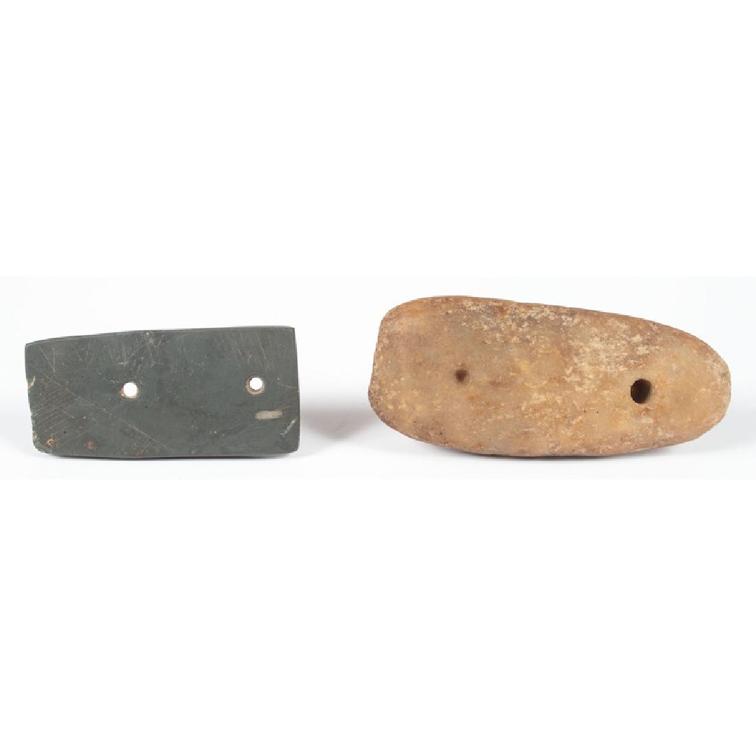 A Rectangular Slate Gorget AND A Quartz Gorget: From the Collection of Jon Anspaugh, Wapakoneta, Ohio Late Archaic - Early Woodland Period, 4000-100 B.C. lot of 2, longest 4 in. The quartz gorget is partially drilled.
