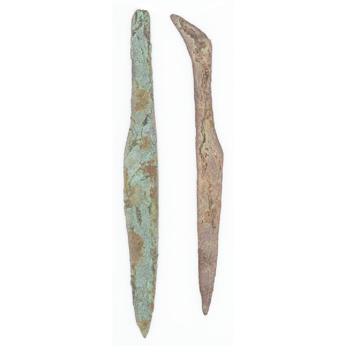 A Pair of Large Old Copper Culture Spear Points: From the Collection of Roger "Buzzy" Mussatti, Michigan Old Copper Culture, 7000-3000 B.C. Vilas County, Wisconsin Gogebic County, Michigan lot of 2, longest 9.25 in.