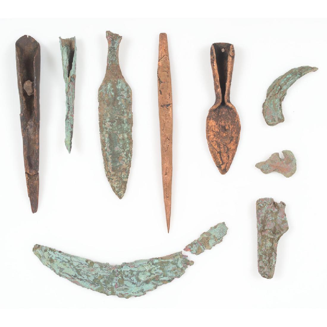 A Group of Old Copper Culture Tools: From the Collection of Roger "Buzzy" Mussatti, Michigan Old Copper Culture, 7000-3000 B.C. Michigan and Wisconsin Crescent knife, tip broken. lot of 9, longest 6 in. Three bright copper pieces were fo