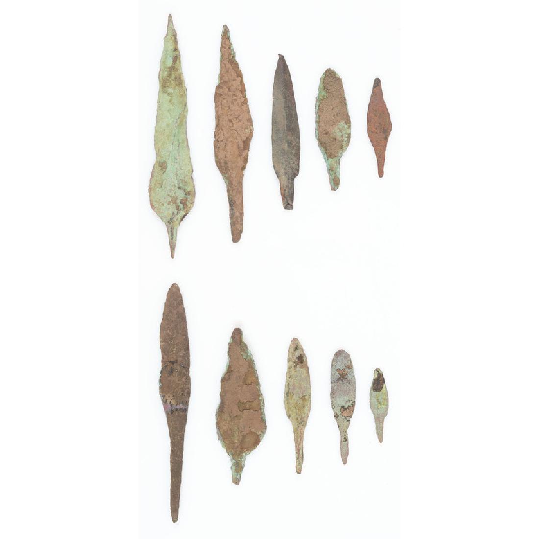 Old Copper Culture Rat Tail Points: From the Collection of Roger "Buzzy" Mussatti, Michigan Old Copper Culture, 7000-3000 B.C. Vilas County, Wisconsin / Gogebic County, Michigan border lot of 10, longest 5.5 in.