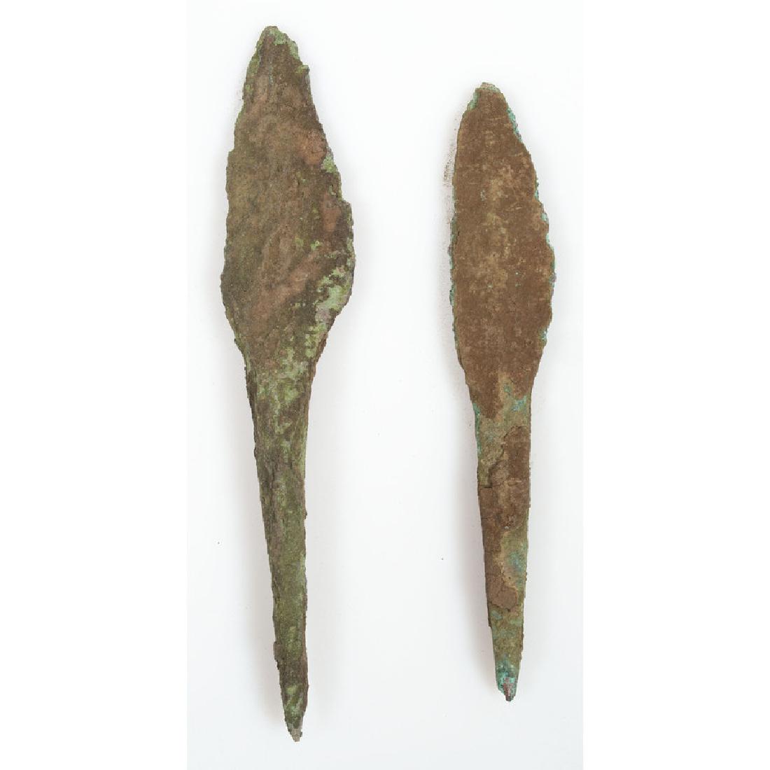 A Pair of Old Copper Culture Rat Tail Spears: From the Collection of Roger "Buzzy" Mussatti, Michigan Old Copper Culture, 7000-3000 B.C. Vilas County, Wisconsin Gogebic County, Michigan lot of 2, longest 4.75 in.
