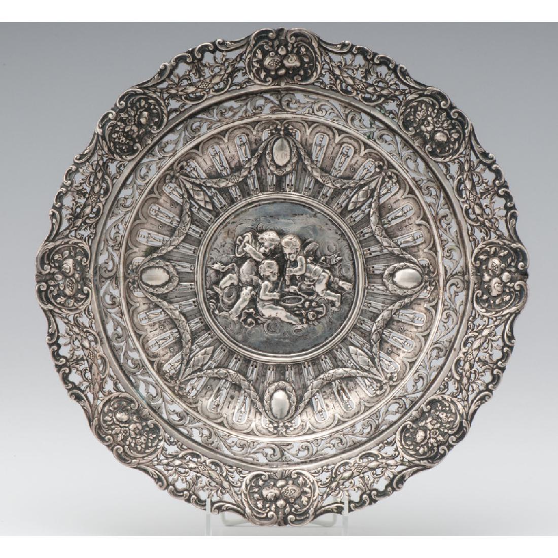 Hanau Silver Footed Bowl: Hanau Silver Footed Bowl German, 19th century. An .800 silver Hanau footed bowl, with intricate pierced border decorated with festoons and bundles of fruit and flowers, the center featuring a repouss&