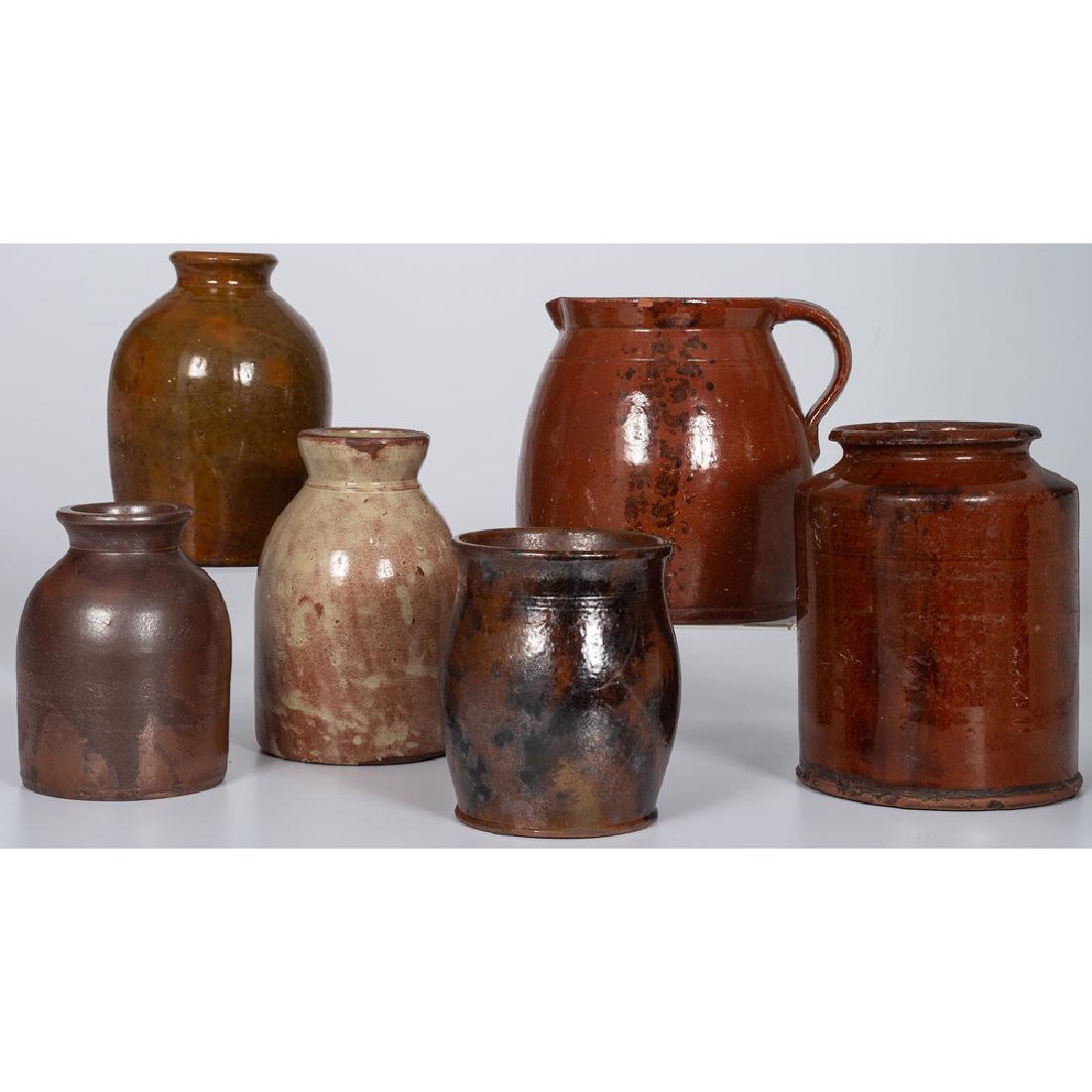 Redware Jars: American, 19th-20th century. A group of six redware jars in various glazes, including a Galena-attributed jar; largest ht. 8 in. Provenance: Property from the Americana Collections of Kenneth and Barb