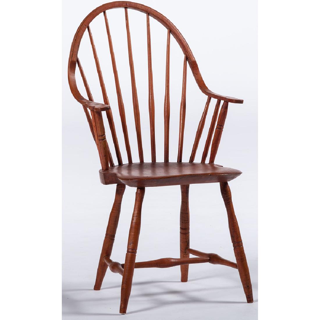 Red Wash Windsor Armchair by B. Green: American, 20th century. A Windsor armchair in red wash, having a hoop back with continuous arms and spindle support, above a plank seat, all rising on turned legs and stretcher support, marked B:Green