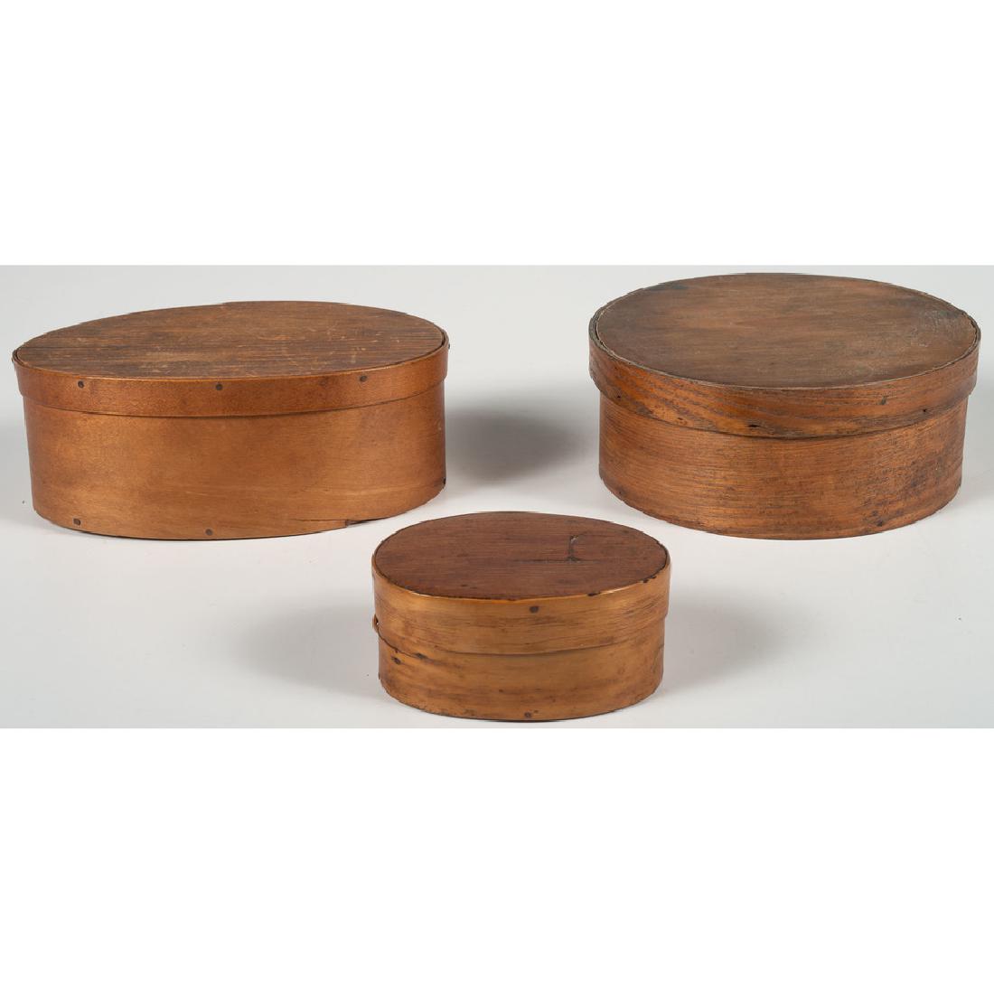 Pantry Boxes: American, 19th century. Two oval fingered pantry boxes, and a round pantry box, the larger oval box having two fingers and the smaller box having a single finger, with a note in the interior Found in 