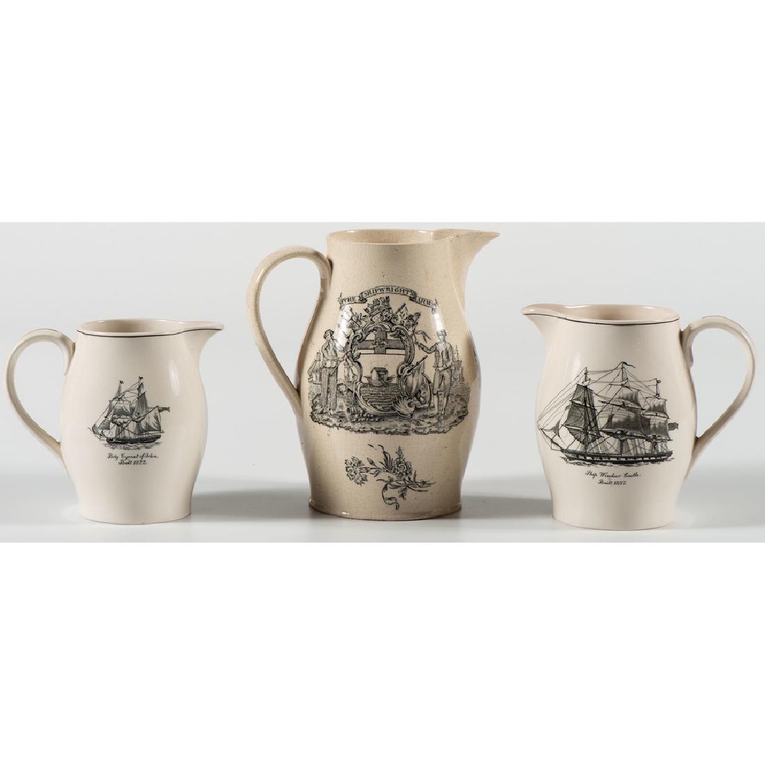 Spode and Creamware Nautical Pitchers: English, 20th century. A reproduction Liverpool transferware pitcher with Ship Carolin e decoration, and two Spode porcelain pitchers with transfer ship decoration; largest ht. 8.5 in.