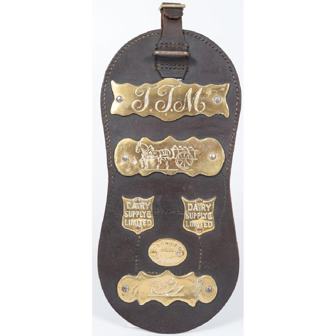 Horse Advertising Bib in Leather and Brass: English, late 19th-early 20th century. A leather horse bib with dairy advertisements on brass plaques, including Dairy Supply Co. Limited and Crowder Derby Saddler ; overall lg. 27.75 (including buckl