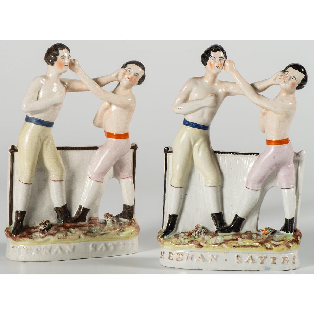Heenan & Sayer Staffordshire Boxing Figures: English, 19th century. Two Staffordshire figural groups of boxers Heenan and Sayer, labeled on bases; ht. 9.25 in. (each).