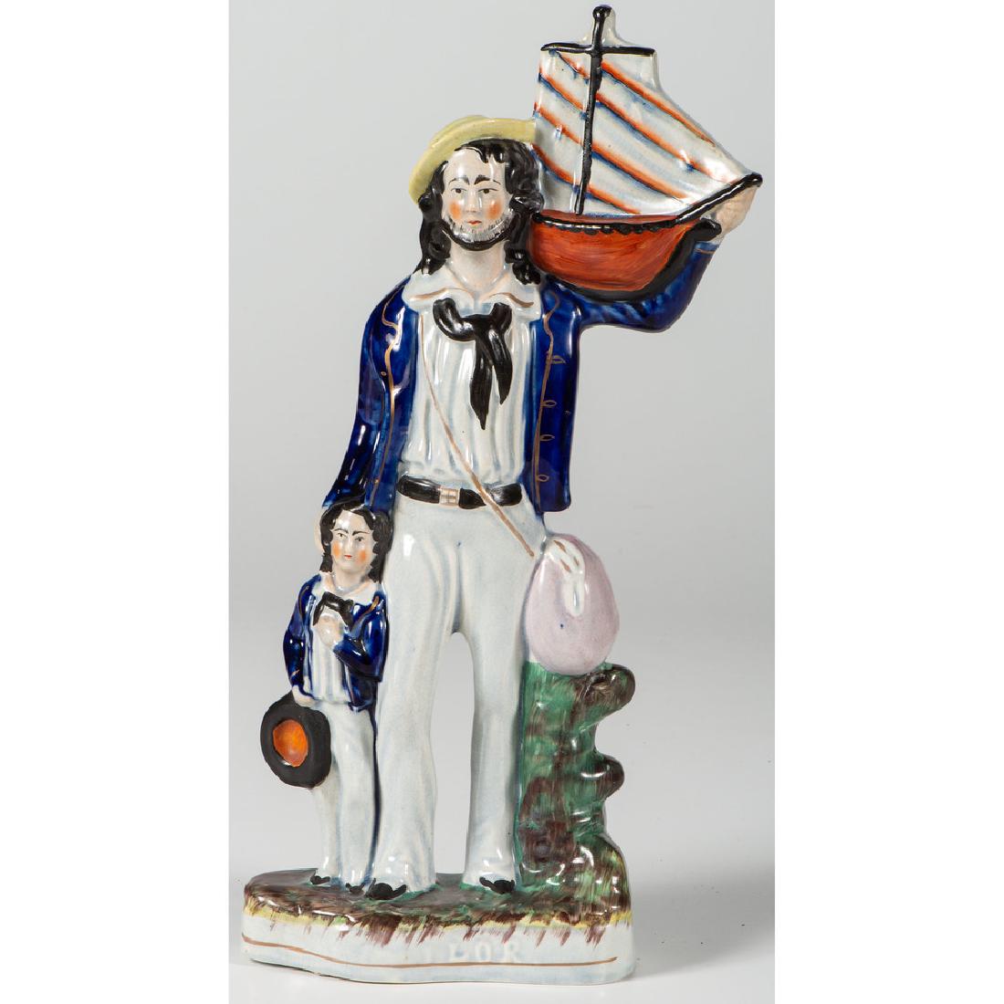 Staffordshire Figural Group, Sailor with Model Ship: English, mid-19th century. A figural group of a child and sailor holding a model ship, titled on base; ht. 15.25 in.